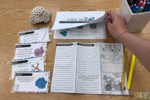 coral reefs task cards on a table with coral reef notes and a coral reef disease brochure