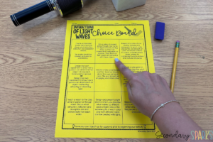 light waves choice board on yellow paper with a microphone. finger pointing to podcast creation choice