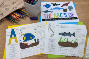 colored pencils, colored pens and papers on top of colored cardstock. Papers are part of a "ABC's of marine vertebrates" project
