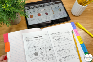 human body systems lesson plans using guided notes and ipad on brown table